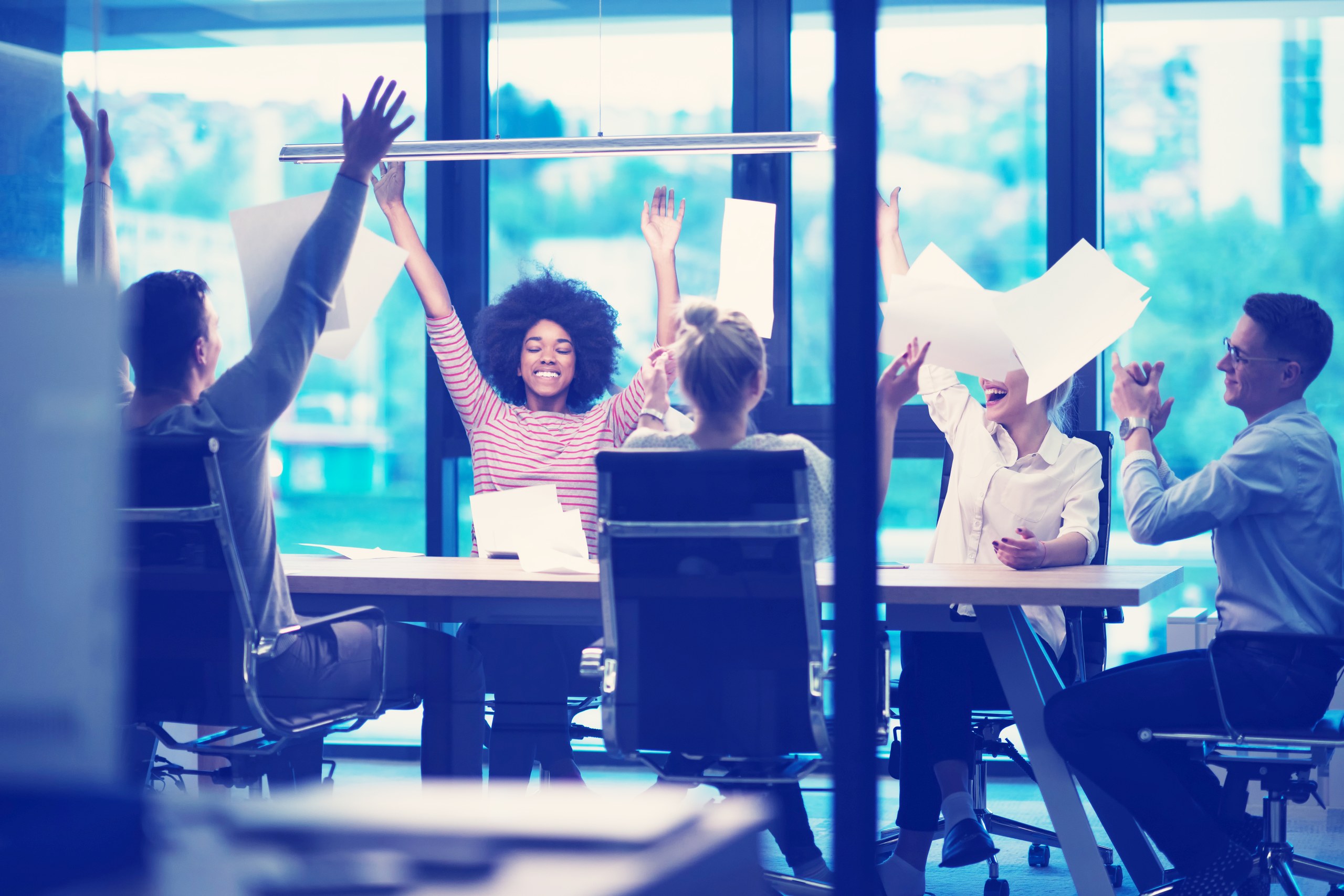 multiethnic Group of young business people throwing documents